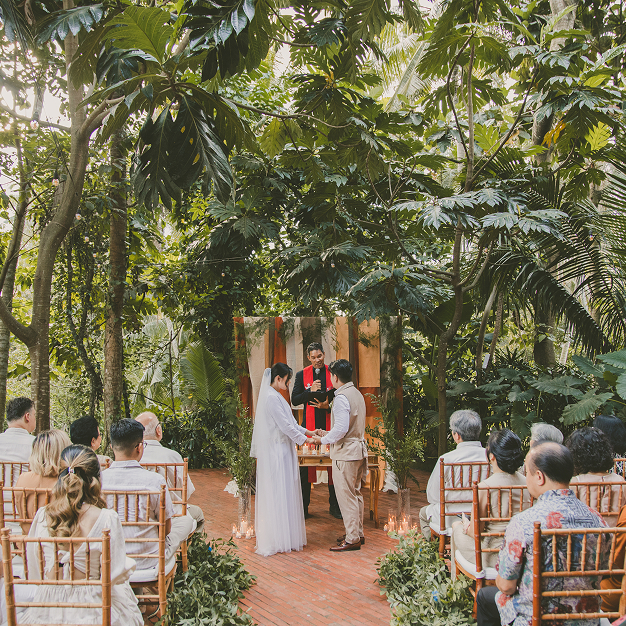 Intimate tropical wedding ceremony in a lush Ubud forest setting at Titik Dua
