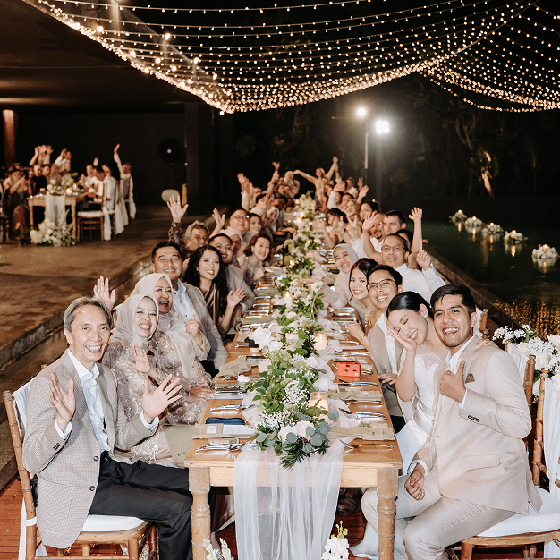 Outdoor wedding reception dinner with lon